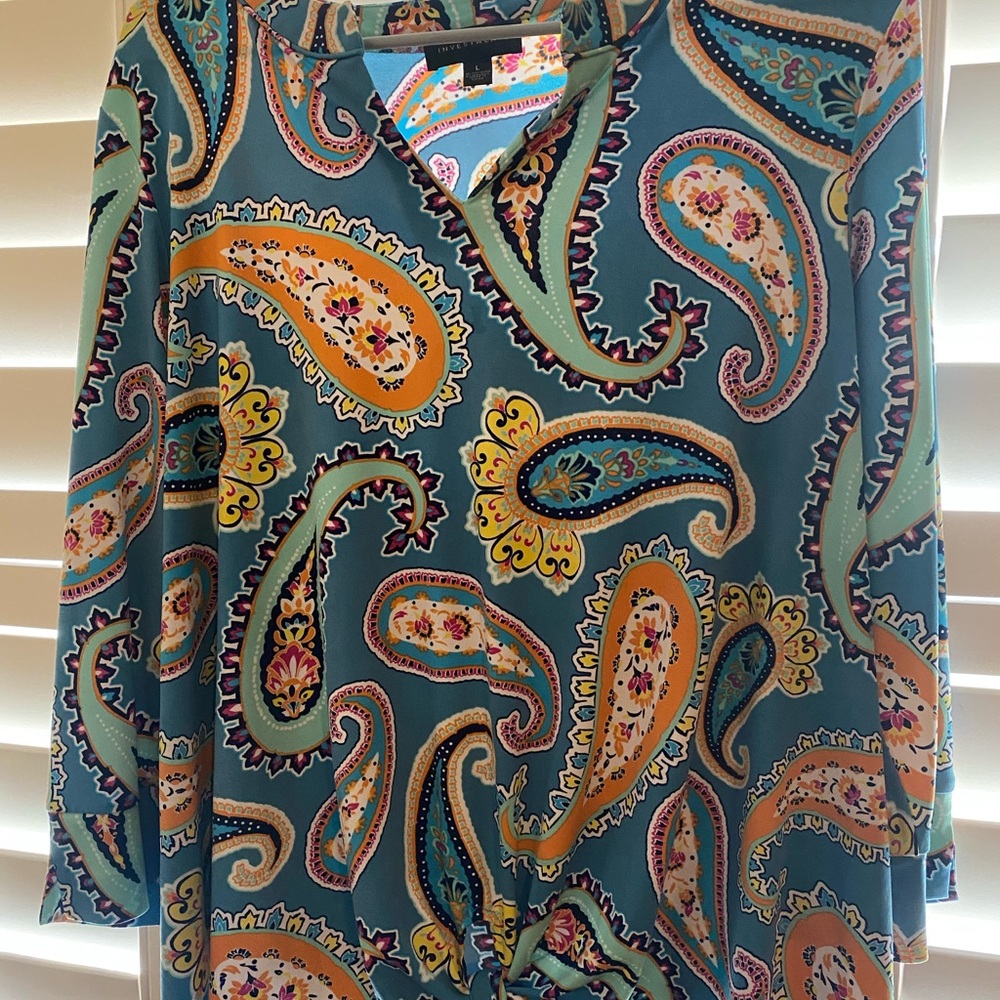Beautiful paisley print top with front tie.  Comfortable and stylish.